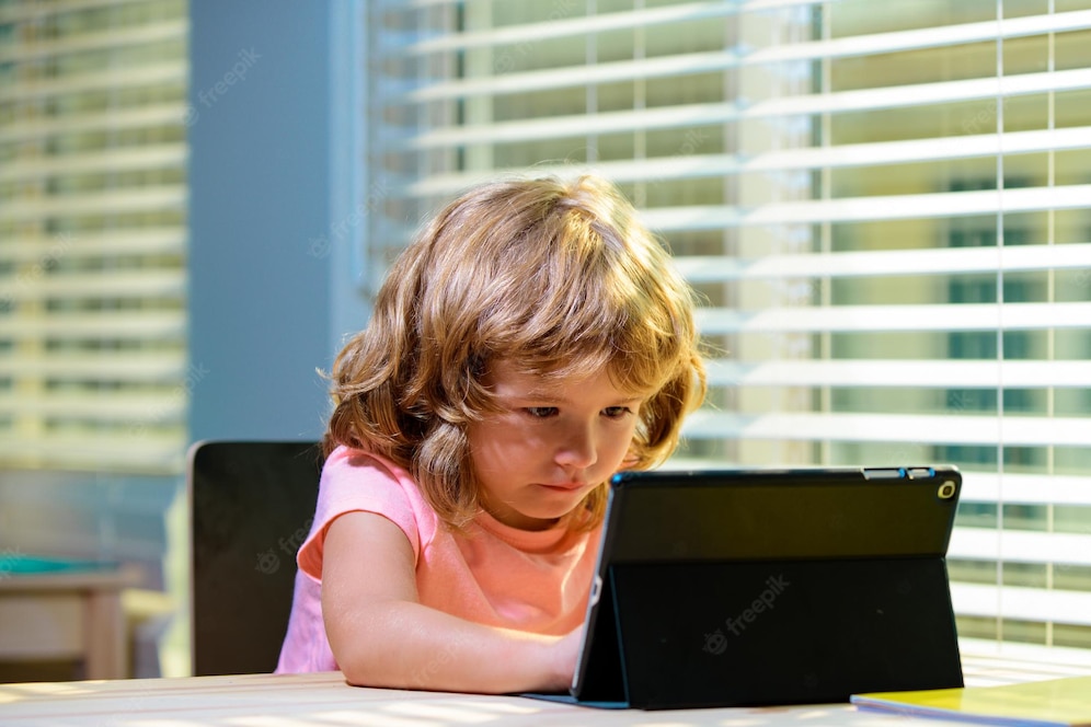 Focused Child Engaged With Tablet